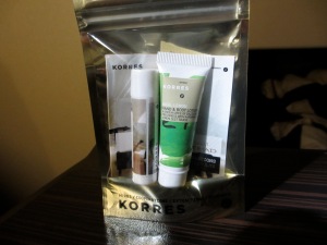 plastic pouch filled with Korres cosmetics, Etihad amenities kit