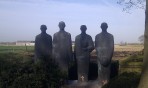 Four statues of men