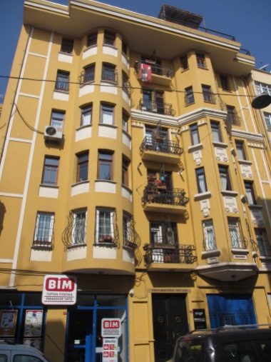 yellow building with bay windows
