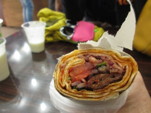 rolls of flat bread with meat and vegetables inside